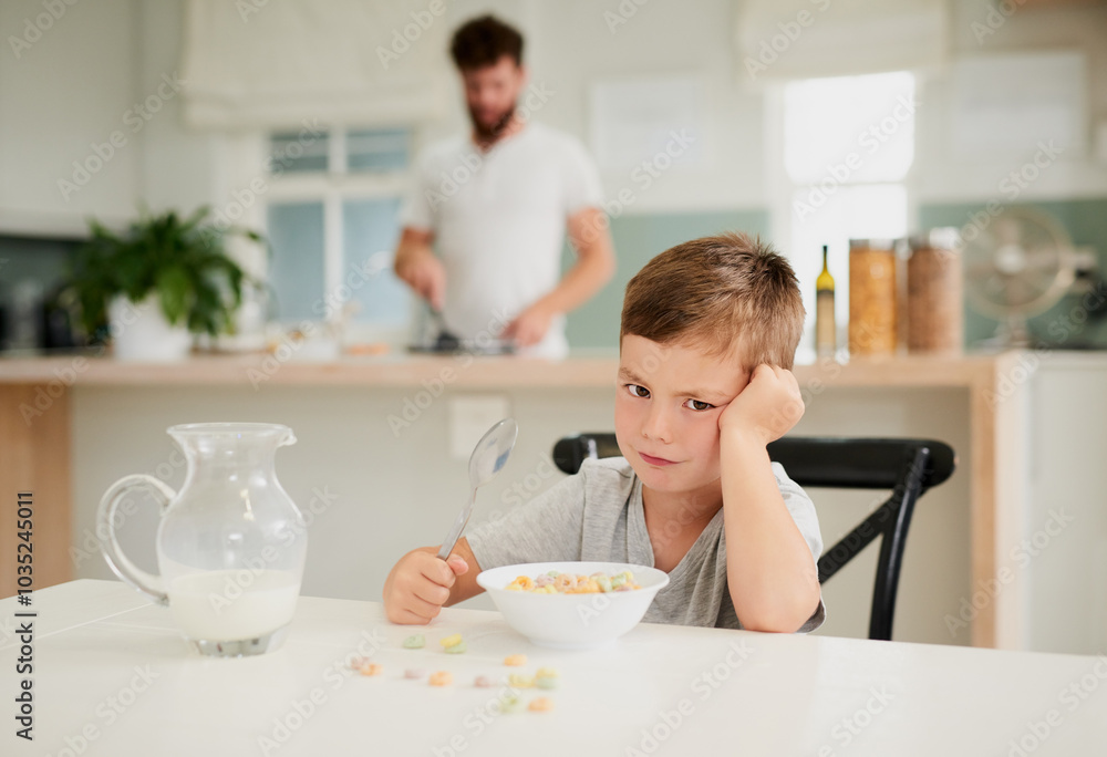 Breakfast, table and sad portrait of boy in home with food, dad and boring nutrition in kitchen. Angry, frustrated and hungry kid eating cereal, milk and diet with morning tantrum at single parent Breakfast, table and sad portrait of boy in home with food, dad and boring nutrition in kitchen. Angry, frustrated and hungry kid eating cereal, milk and diet with morning tantrum at single parent