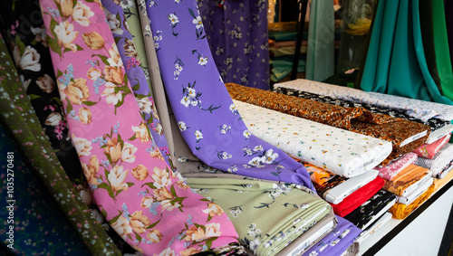 Fabrics and bolts of fabric in various colors and patterns. Haagse Market in The Hague, Netherlands.