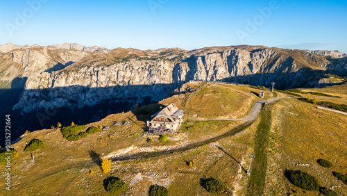 Aerial view of the majestic hochschwab mountain and serene Aflenzer Buergeralm hut in autumn, Aflenz, Austria. photo