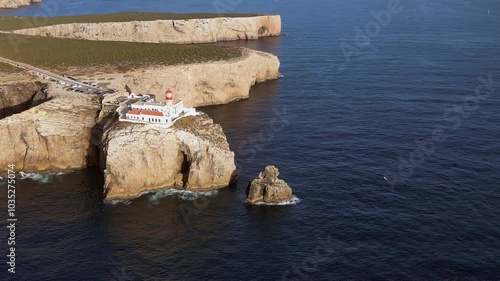 Golden light on cliffs below St Vincent lighthouse on Portugal coast
