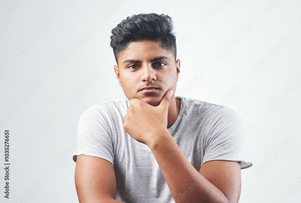 Indian man, portrait and fashion with casual style, tshirt or hairstyle in studio on a white background. Young, male person or handsome gen z model with serious face, confidence or cool attittude Indian man, portrait and fashion with casual style, tshirt or hairstyle in studio on a white background. Young, male person or handsome gen z model with serious face, confidence or cool attittude