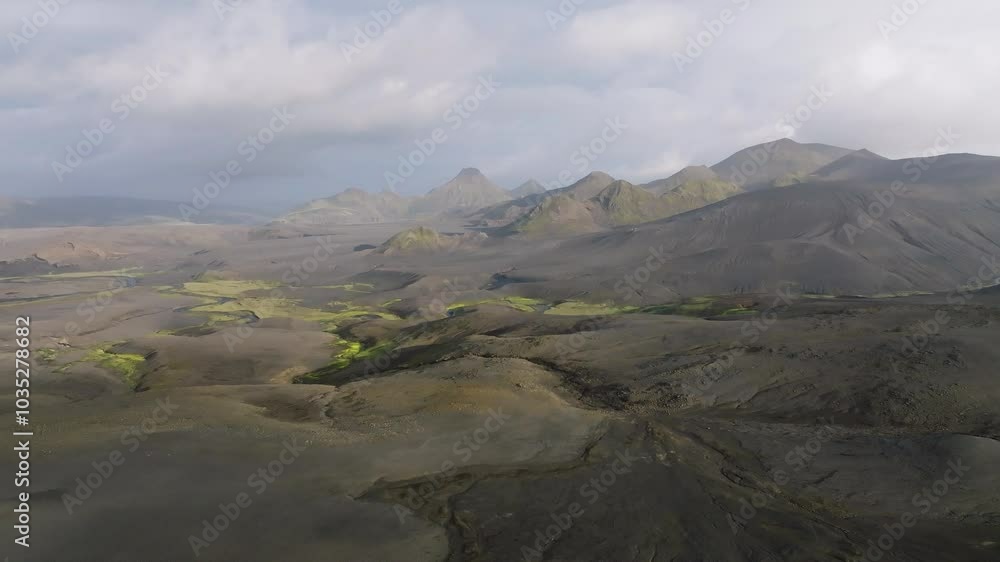 Aerial view of beautiful rugged mountains and serene valley in a breathtaking landscape, Langisjor, Sudruland, Iceland. Aerial view of beautiful rugged mountains and serene valley in a breathtaking landscape, Langisjor, Sudruland, Iceland.