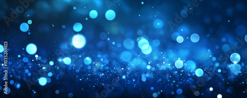 Abstract blue background with glowing particles, glitter, and bokeh on a dark blue gradient. AI generation