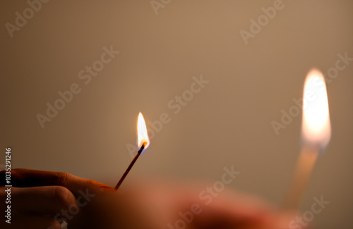 hand holding a match