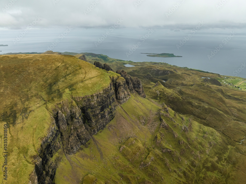 Aerial view of the majestic Quiraing mountain with rugged cliffs and scenic landscapes, Portree, Scotland. Aerial view of the majestic Quiraing mountain with rugged cliffs and scenic landscapes, Portree, Scotland.