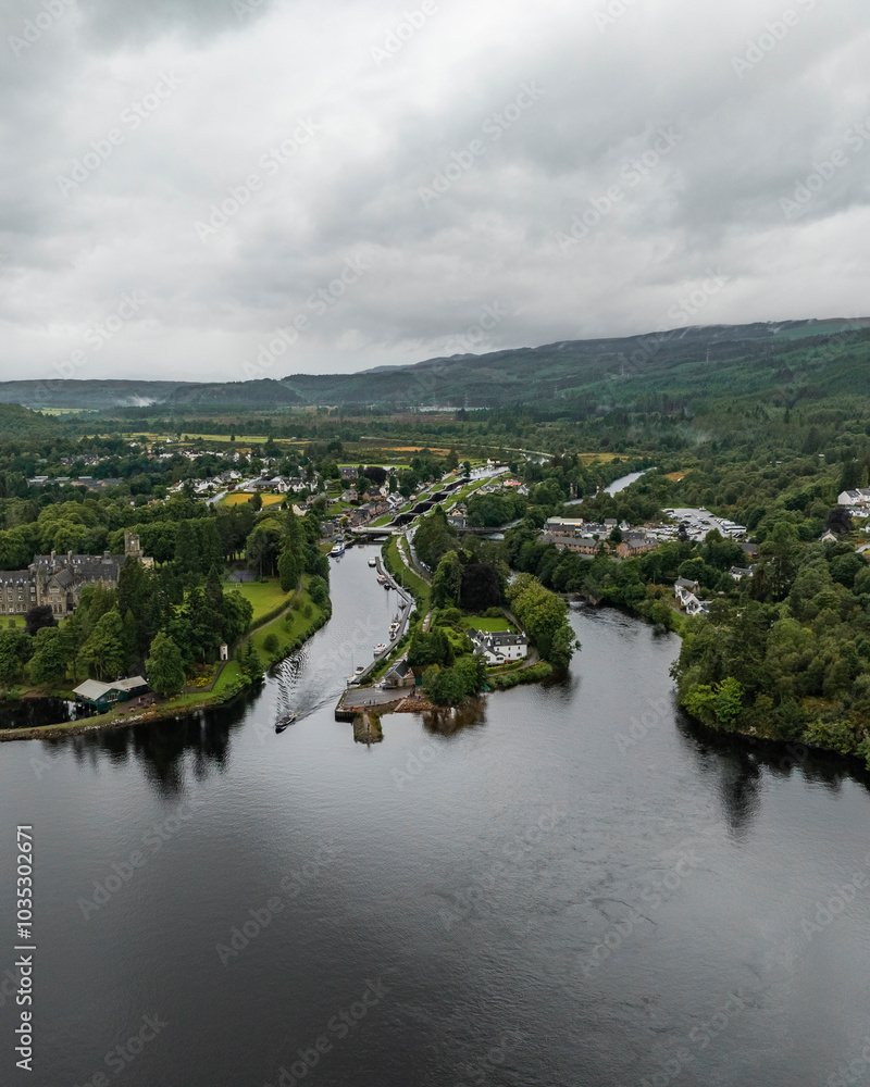 Aerial view of serene Loch Ness surrounded by lush forests and picturesque hills, Fort Augustus, Scotland. Aerial view of serene Loch Ness surrounded by lush forests and picturesque hills, Fort Augustus, Scotland.