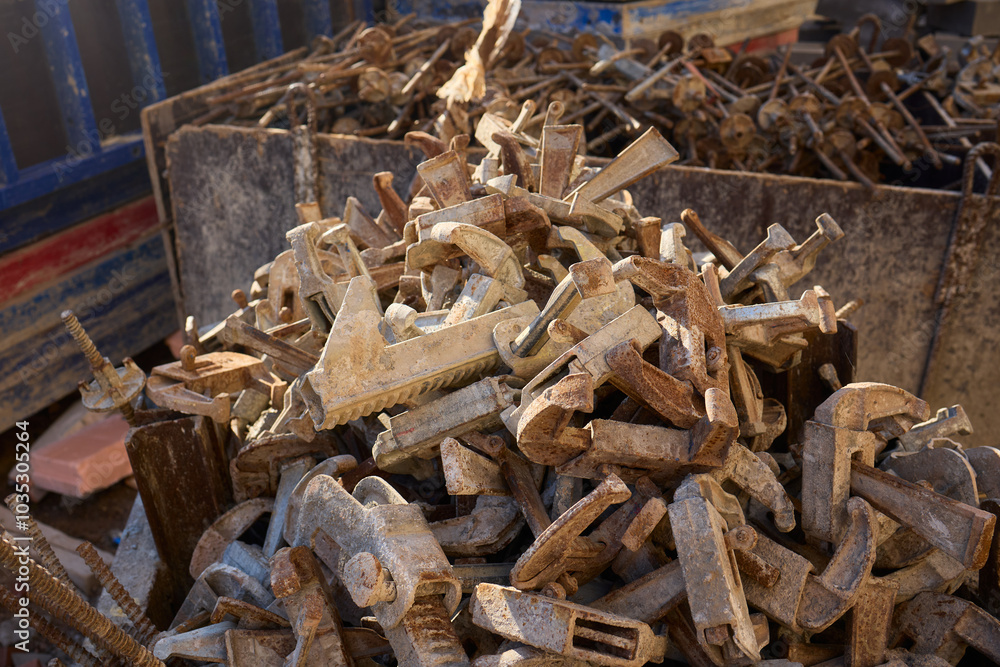Rusty metal and steel rods discovered on a construction site amidst other equipment and debris Rusty metal and steel rods discovered on a construction site amidst other equipment and debris