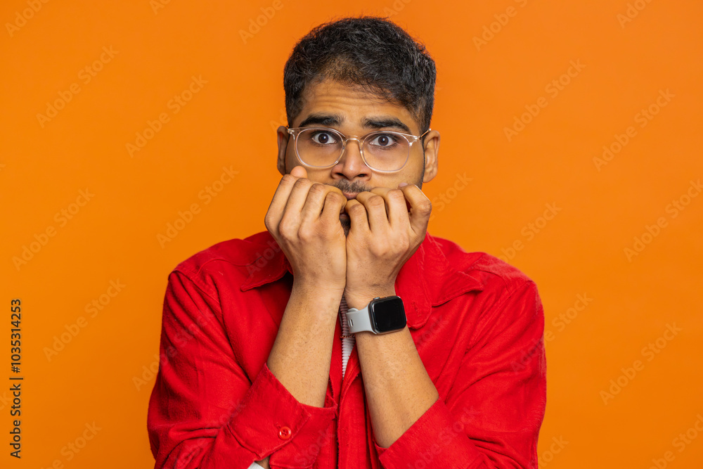 Stressed depressed Indian man terrified about danger problems, suffering phobia, anxiety disorder, expresses fear, waving no, insecure, stress, panic. Scared fearful Hindu guy on orange background Stressed depressed Indian man terrified about danger problems, suffering phobia, anxiety disorder, expresses fear, waving no, insecure, stress, panic. Scared fearful Hindu guy on orange background
