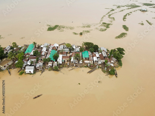 Aerial view of flooded village with waterlogged houses and boats, Balijuri, Tahirpur, Sylhet, Bangladesh. photo