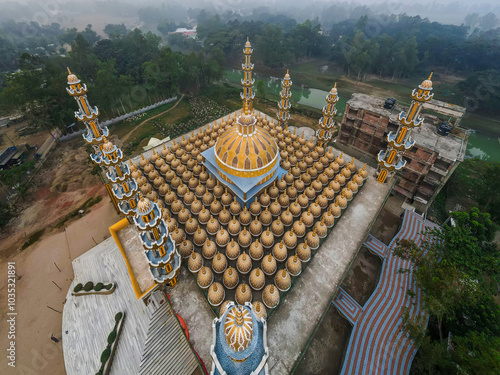 Aerial view of the beautiful 201 Dome Mosque surrounded by lush trees and scenic landscape, Gopalpur, Bangladesh. photo