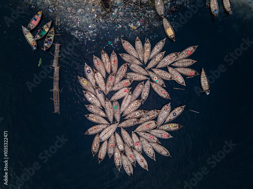 Aerial view of passenger boats docked on the serene Buriganga river surrounded by a vibrant community, Aganagar, Keraniganj, Bangladesh. photo