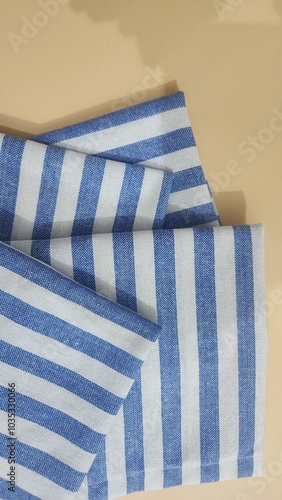 Cotton Blue and White Color Stripes Fabric Over Brown Background.  