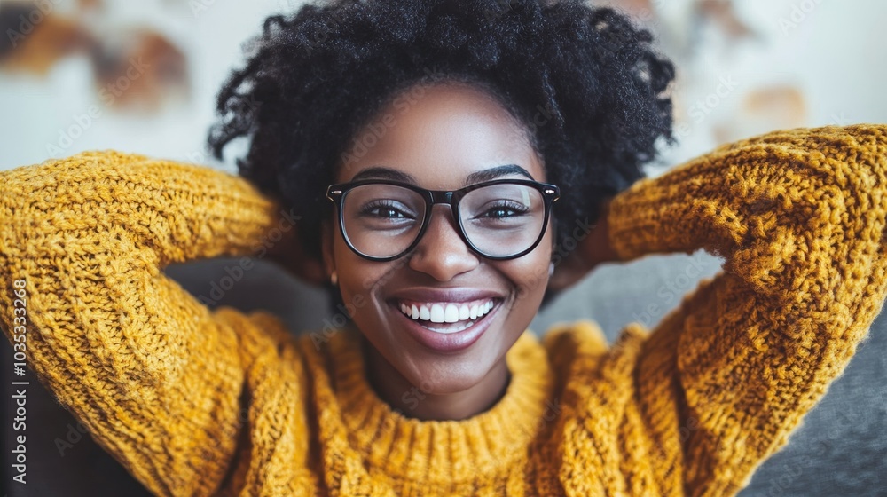 Portrait of a Happy Young Woman with Glasses and a Bright Smile, Relaxing in a Cozy Yellow Sweater Portrait of a Happy Young Woman with Glasses and a Bright Smile, Relaxing in a Cozy Yellow Sweater