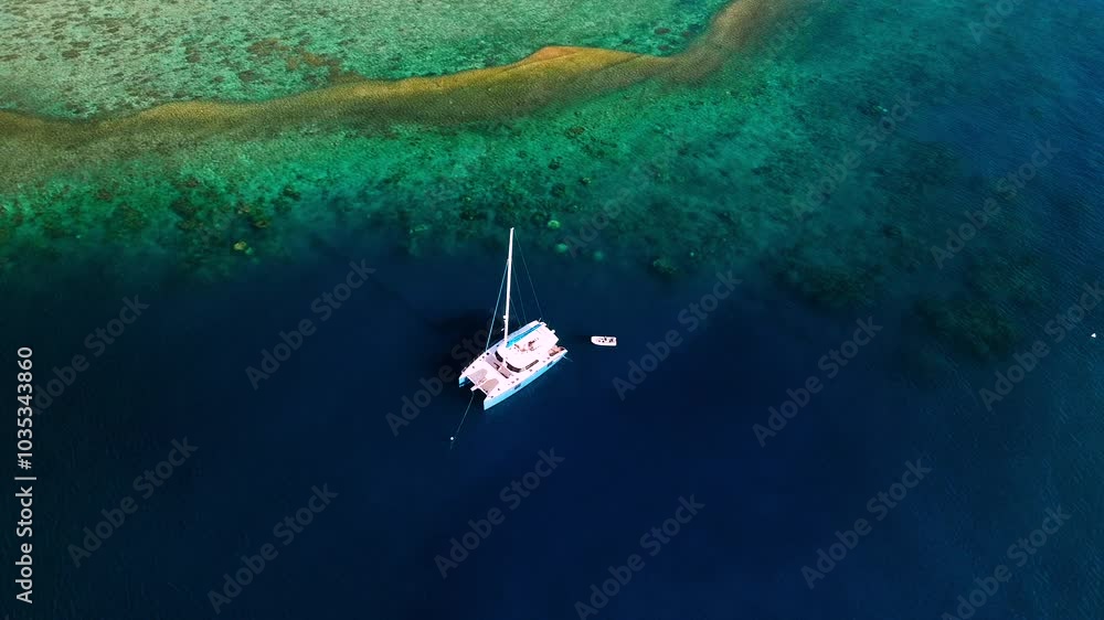 Aerial view of ocean patterns and coral reef with boats and yachts, Whitsundays, Australia. Aerial view of ocean patterns and coral reef with boats and yachts, Whitsundays, Australia.