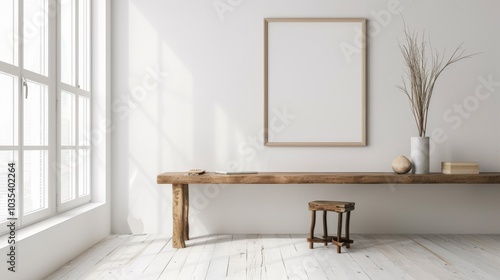 A minimalist home office with white walls and a wooden desk. The desk features a blank picture frame and a small notebook. Soft