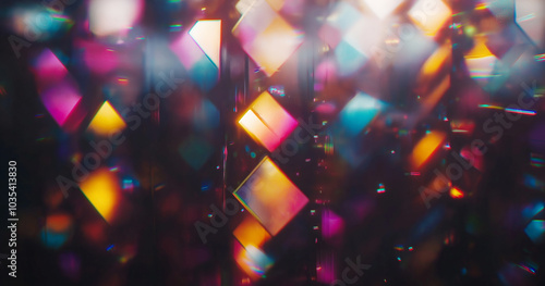 A colorful abstract composition featuring a blend of bright, multicolored prisms and diamond shapes reflecting light on a dark background, creating a kaleidoscopic and energetic visual effect