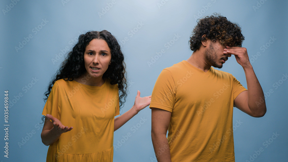 Excited happy shocked wonder amazed surprised Arabian couple winners Indian man woman amazing good news achieve win victory achievement triumph shout screaming yelling winning blue studio background Excited happy shocked wonder amazed surprised Arabian couple winners Indian man woman amazing good news achieve win victory achievement triumph shout screaming yelling winning blue studio background