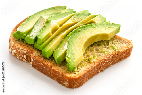 Classic avocado toast with neatly arranged avocado slices on toasted bread. Breakfast food concept photo