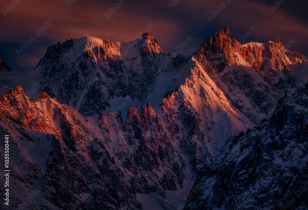 View of majestic snowcapped Les Grandes Jorasses at sunset with dramatic sky, Chamonix, France. View of majestic snowcapped Les Grandes Jorasses at sunset with dramatic sky, Chamonix, France.
