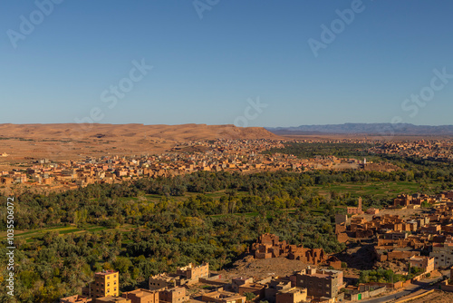 View of Todra Gorge with beautiful stone houses and greenery in the valley, Tinghir, Morocco. photo