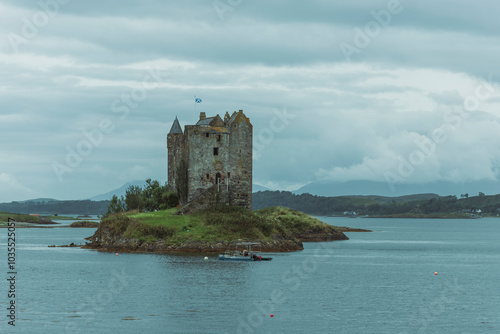 Wallpaper Mural View of Castle Stalker on an island in Loch Linnhe with serene reflections and a picturesque sky, Appin, United Kingdom. Torontodigital.ca