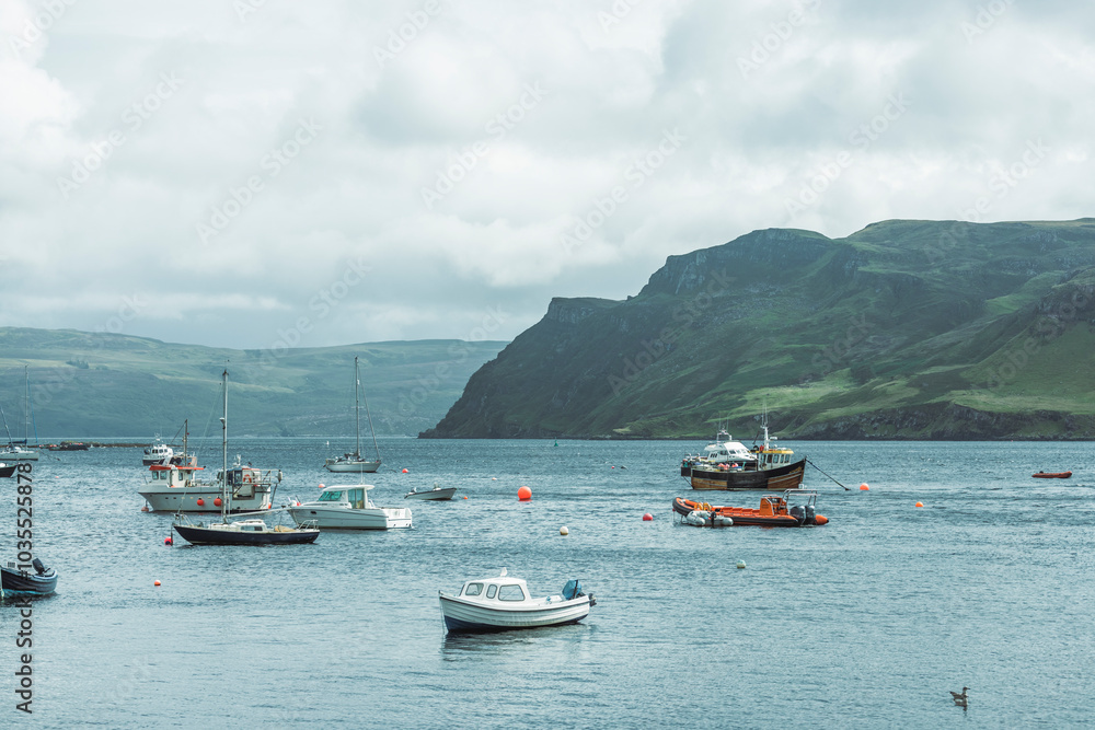 View of serene Loch Portree with moored boats and tranquil hills, Portree, Scotland. View of serene Loch Portree with moored boats and tranquil hills, Portree, Scotland.