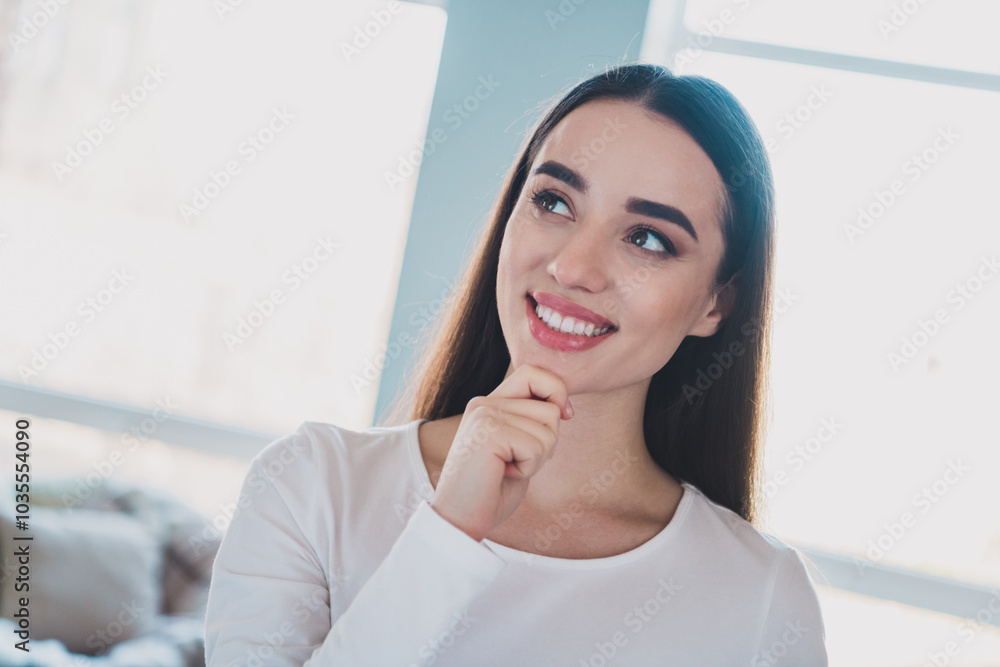 Portrait of lovely young girl hand touch chin think wear white pullover bright interior flat indoors Portrait of lovely young girl hand touch chin think wear white pullover bright interior flat indoors