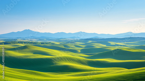 A breathtaking view of rolling hills under a clear blue sky.