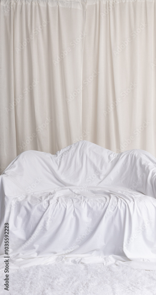 Minimalist White Fabric-Draped Couch with Soft Curtain Background Minimalist White Fabric-Draped Couch with Soft Curtain Background