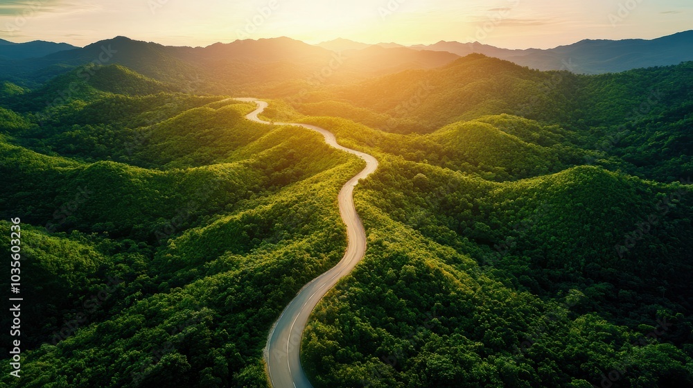 A winding road through lush green mountains at sunset, showcasing nature's beauty and serenity in vibrant colors. A winding road through lush green mountains at sunset, showcasing nature's beauty and serenity in vibrant colors.
