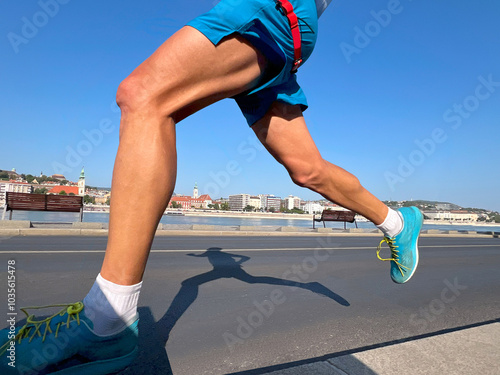 legs athlete runner, shadow on asphalt of running man