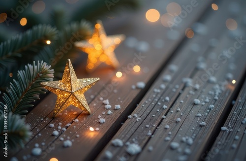 Golden Christmas stars on snowy wooden background. photo