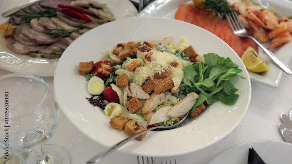 A delicious festive table, many different salads and cuts. Dishes for a Ukrainian wedding, various dishes. Food on a white table A delicious festive table, many different salads and cuts. Dishes for a Ukrainian wedding, various dishes. Food on a white table