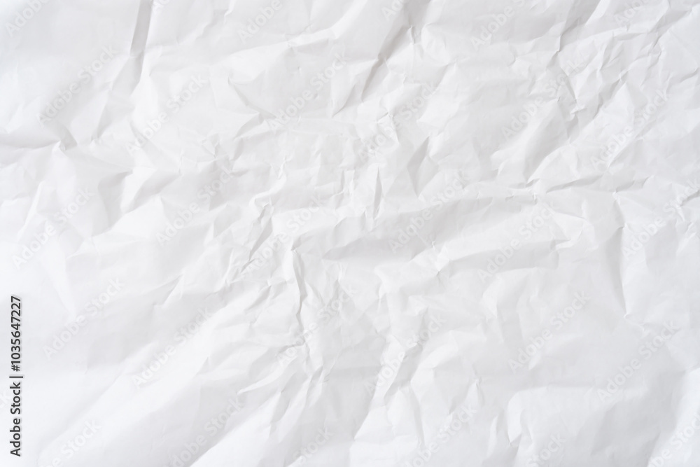 Top view and full frame of wrinkled or crumpled white stencil paper texture used for wrinkled or crumpled white paper background texture in decorative art work Top view and full frame of wrinkled or crumpled white stencil paper texture used for wrinkled or crumpled white paper background texture in decorative art work