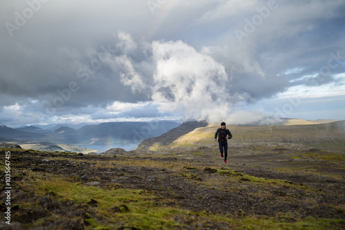 Trail runner running in nordic mountains