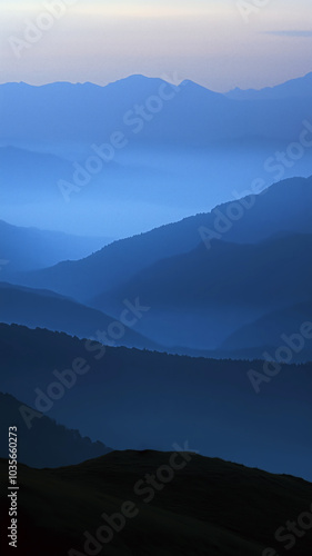 serene mountain view at dusk, showcasing layers of blue hues and tranquility