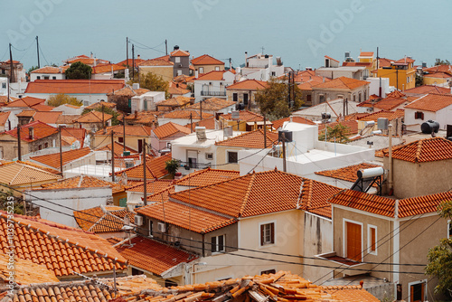 Red roofs of the old houses on Samos island in Marathokapmos town in Greece. photo