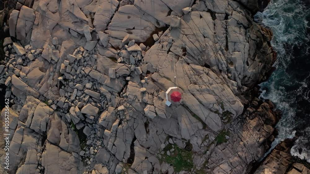 Top View. Beautiful Aerial View Of Peggy's Cove Lighthouse On The Atlantic Coastline Near Halifax, Nova Scotia, With A Breathtaking Sunset Over The Ocean. Top View. Beautiful Aerial View Of Peggy's Cove Lighthouse On The Atlantic Coastline Near Halifax, Nova Scotia, With A Breathtaking Sunset Over The Ocean.