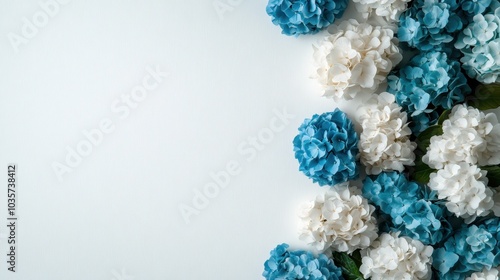 Charming side-aligned floral arrangement of blue and white hydrangeas, offering a stylish and fresh element for any sophisticated decorative project.