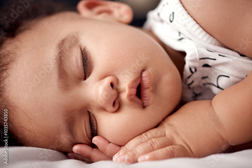 Boy, baby and sleeping on blanket in home, relax and tired infant in nursery for growth development. Child, nap and comfortable resting on bed for peace, closeup and kid fatigue or dream in apartment