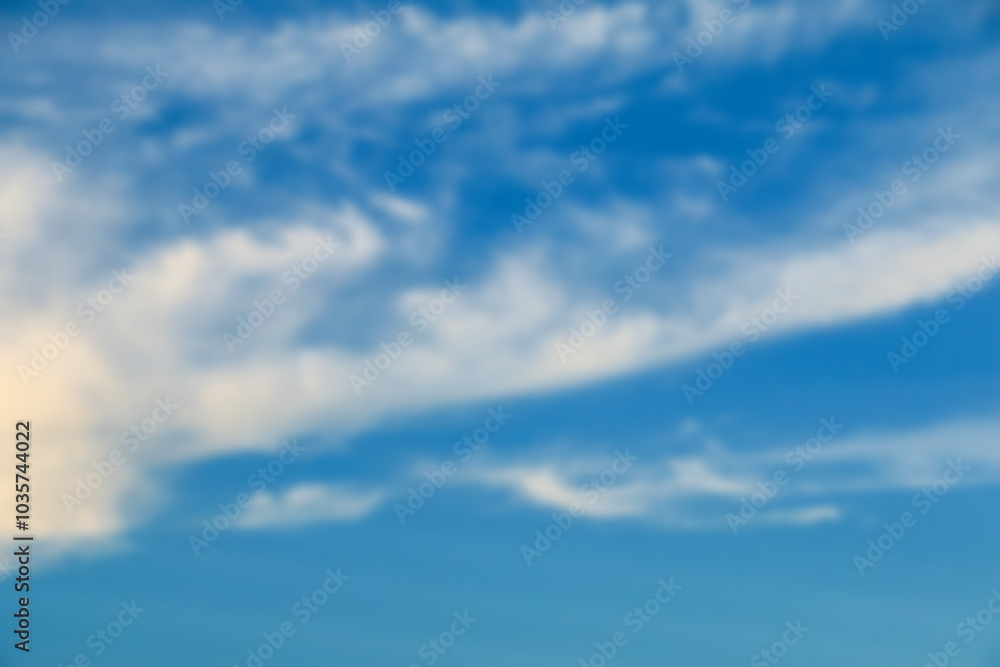 Fototapeta premium Evening sky with soft blur effect, featuring calm hues for use in background designs or peaceful themes