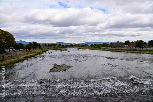 The view of Katsura River at autumn from Togetsukyo Bridge, Kyoto, Japan. A well-known place of scenic beauty in the western hills of Kyoto. Nature and travel concept. photo