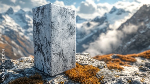 Marble Monolith in Mountain Landscape with Snow-Capped Peaks and Cloudy Sky photo