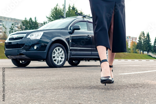 Wallpaper Mural A girl in black walks away from her car. Torontodigital.ca