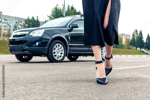 Wallpaper Mural A girl in black walks away from her car. Torontodigital.ca