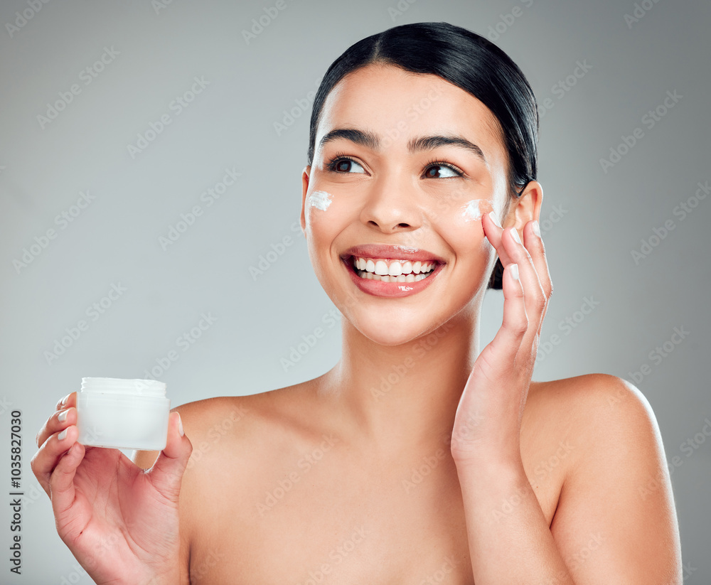 Face cream, beauty and woman with skincare in studio with nourishment, hydration and glow. Happy, health and person with moisturizer for facial, cosmetic or dermatology routine by gray background. Face cream, beauty and woman with skincare in studio with nourishment, hydration and glow. Happy, health and person with moisturizer for facial, cosmetic or dermatology routine by gray background.