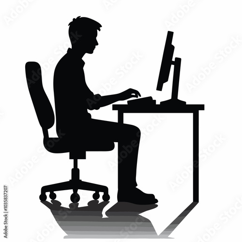 Silhouette of person working at computer desk in office setting