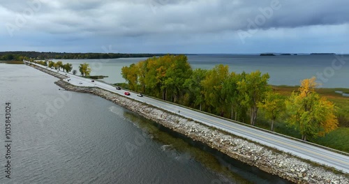 Wallpaper Mural Highway crosses the waterscape of Lake Champlain in Vermont, New England, USA. Overcast sky is above the scenery. Aerial view. Torontodigital.ca