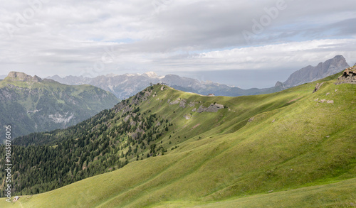 Belvedere mountain shelter on green slopes, Canazei, Italy