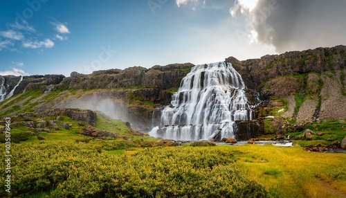 dynjandi is one the most famous waterfall of the west fjords of iceland at summer photo